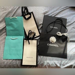 Shopping bags and one Chanel scarf box